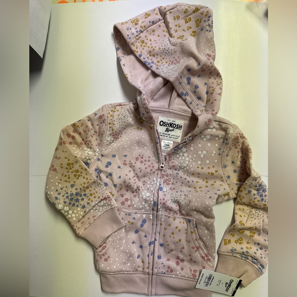This adorable hoodie is from Oshkosh B’gosh new with tags size 24 months.